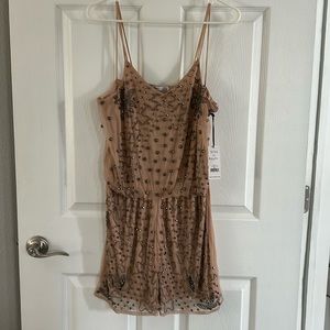 Beautiful beaded neutral color romper.